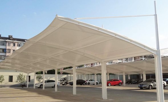 Steel carport with tensile membrane canopy