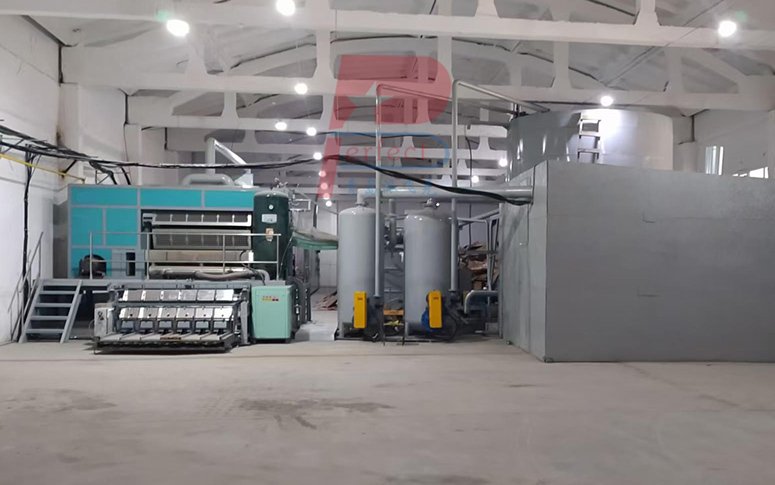 How does an automatic egg tray production line with a metal drying system operate?