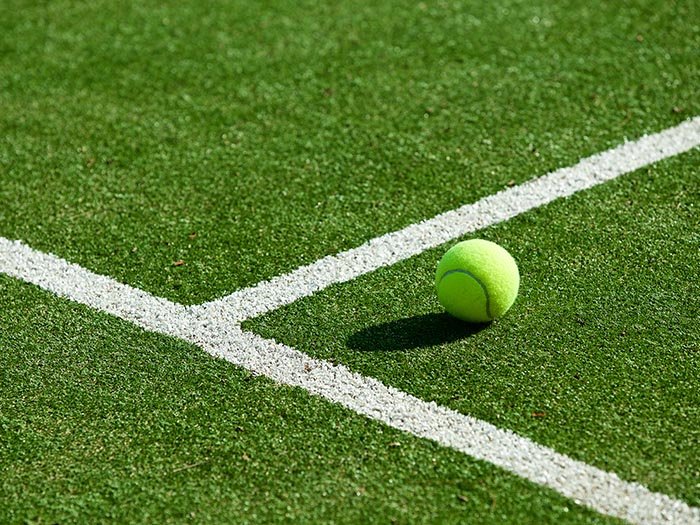 Low-impact tennis turf for players
