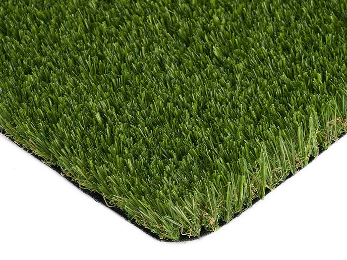 Artificial grass installation in hotel outdoor dining area