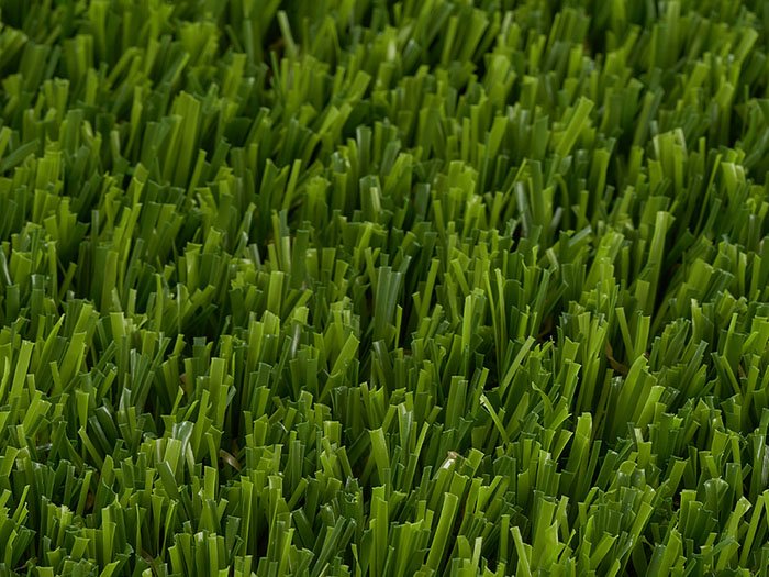 Synthetic grass creating inviting outdoor dining space