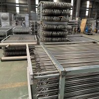 Evaporative cooling condenser coil for process fluids