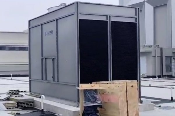 Installed open crossflow cooling tower operating at industrial site