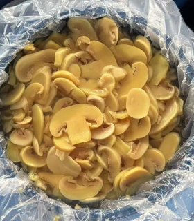 Brined mushroom  slices in drum