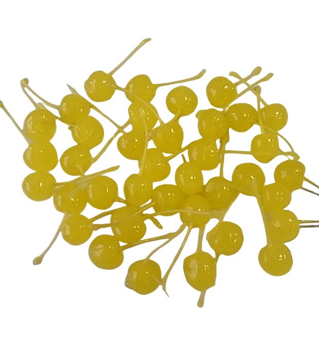 yellow cherries arranged neatly on dish