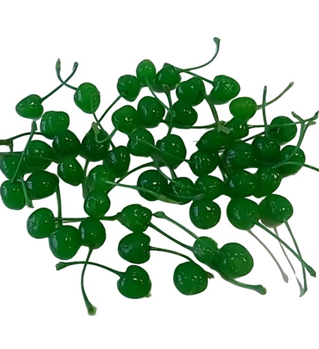 green maraschino cherries arranged in plate