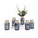 compact transparent glass vase used for tabletop floral decor