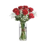 clear round vase styled with dried botanicals on a tabletop to enhance interior aesthetic