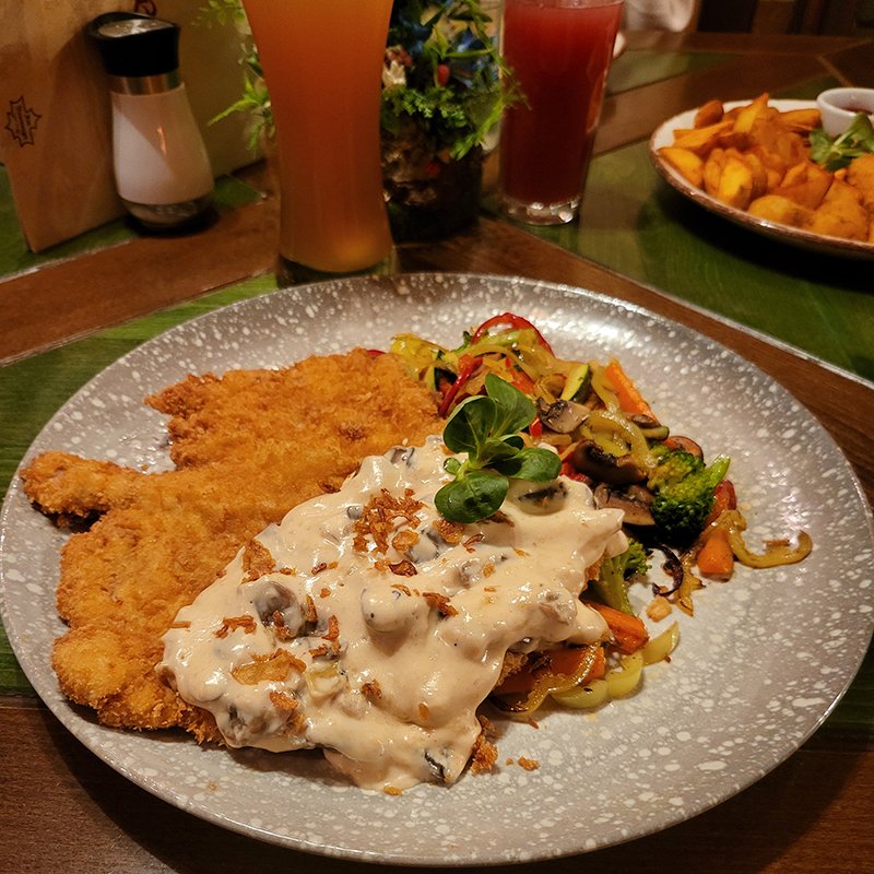 thick cheese glaze adhering to fried chicken pieces