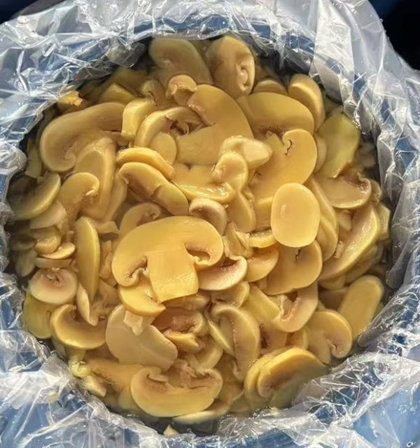Brined mushroom  slices in drum
