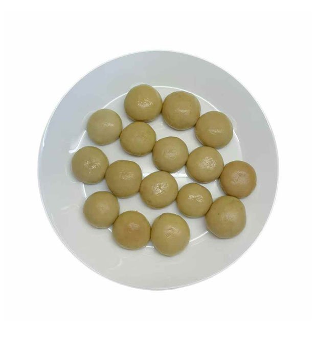 mushroom wholes in light brine jar