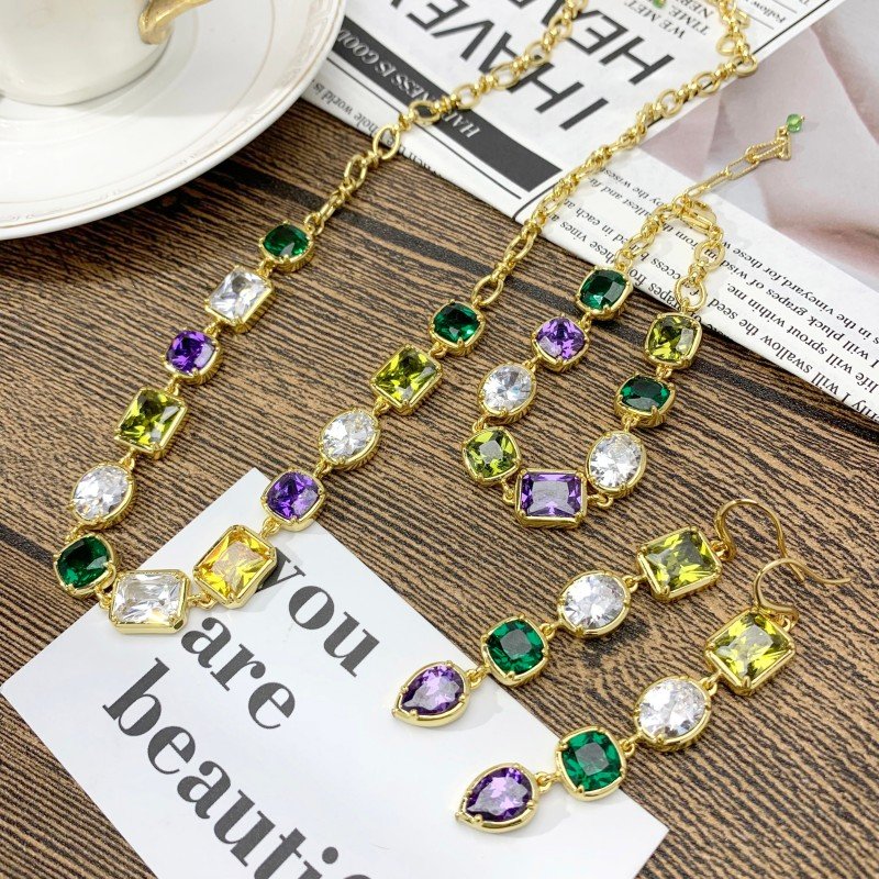 Set of necklace, bracelet and earrings with Inlaid zirconia