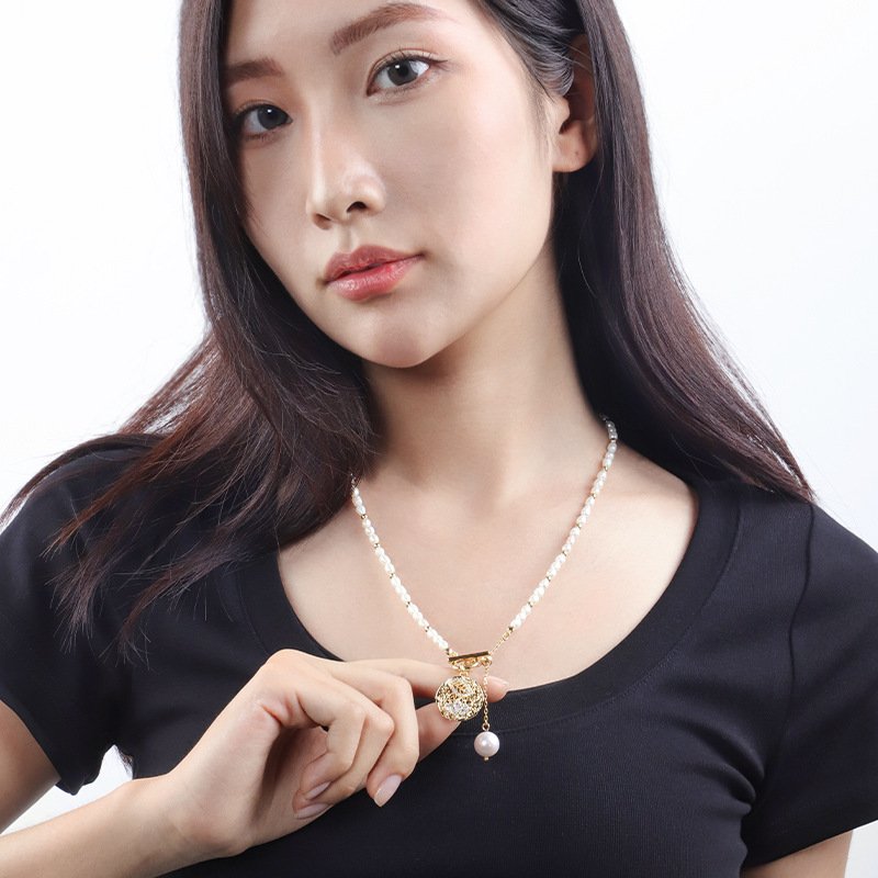 Retro round hollow pendant pearl tassel necklace