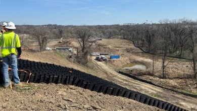 How do geocells help stabilize slopes?