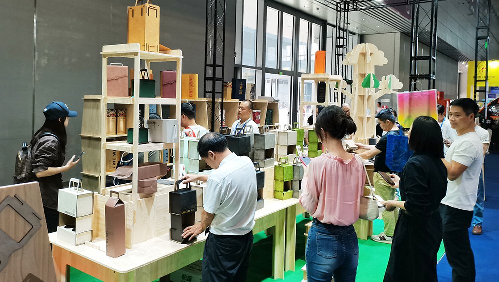 A steady flow of visitors explores our booth's printing showcases.