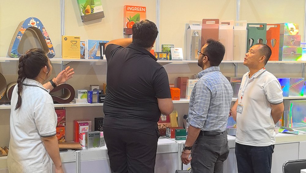 Our booth buzzes with activity as visitors check out printing offerings.